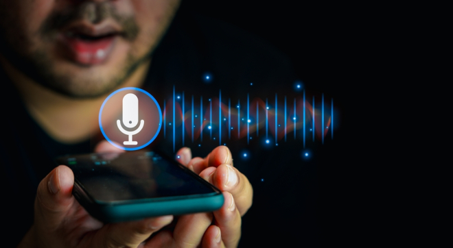 Man using voice command on smartphone, interacting with digital assistant: showcasing the rise of AI-driven technology in everyday communication and SEO.